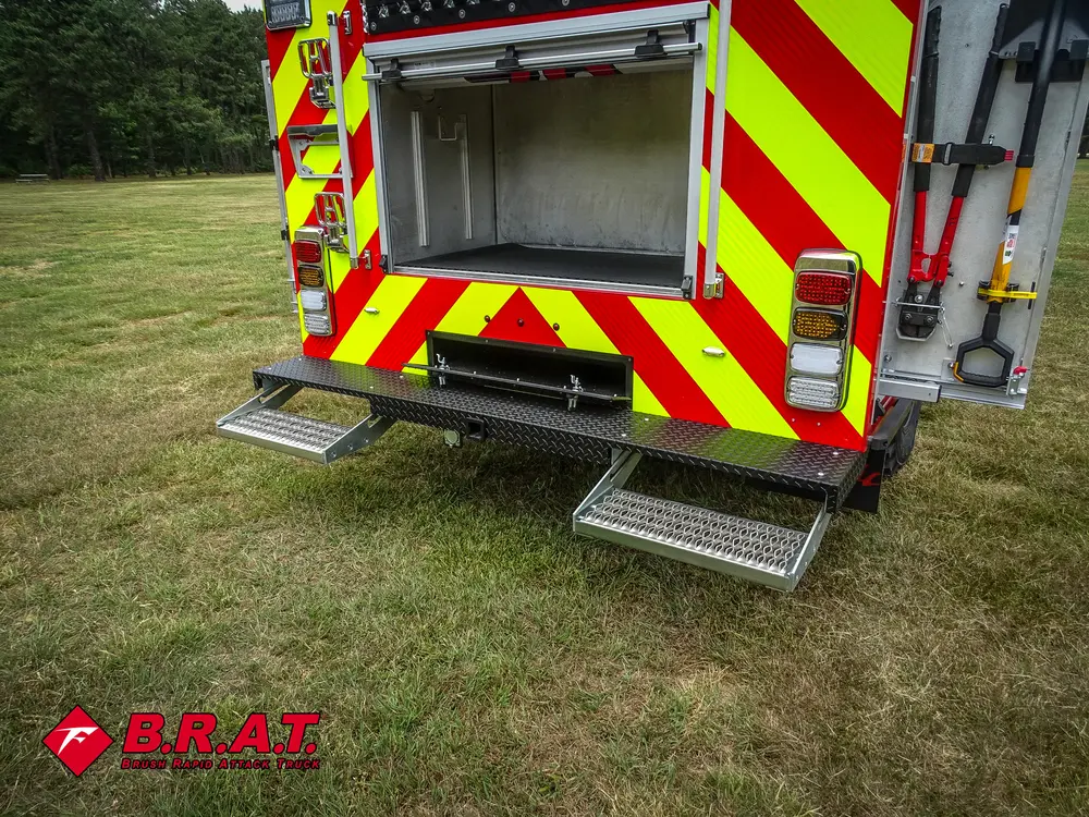 Rear-right corner with open compartment and fold-down rear platform.