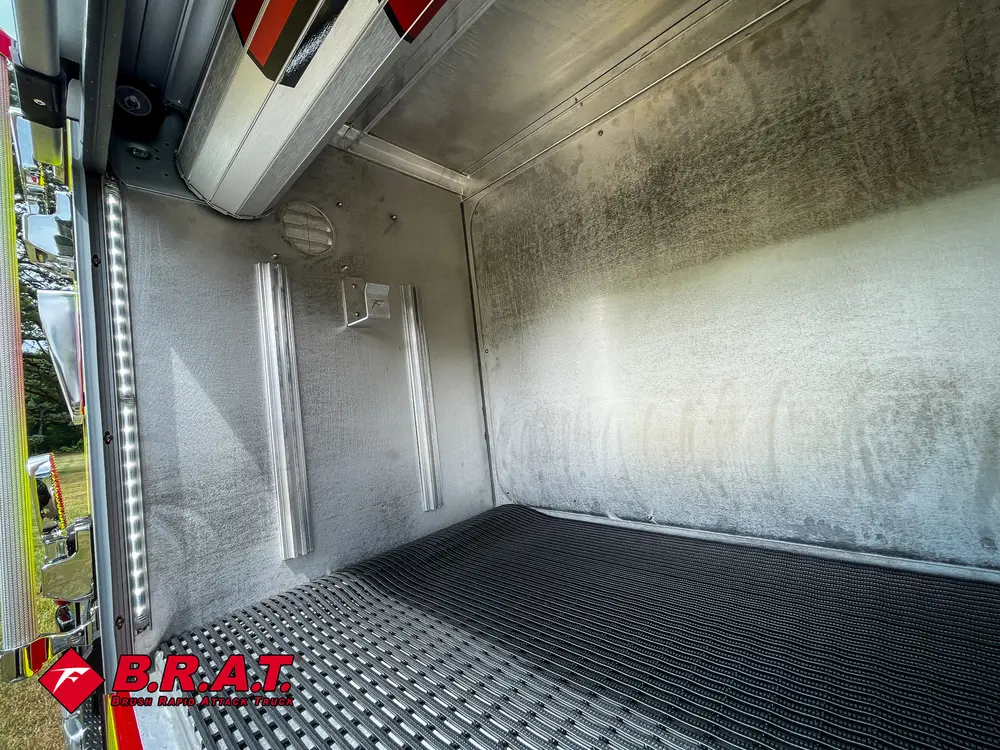 Rear compartment interior from opposite side with smooth metal walls.