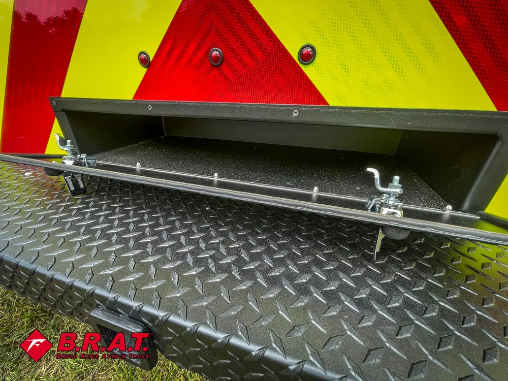 Lower rear hatch open showing underside latching hardware.