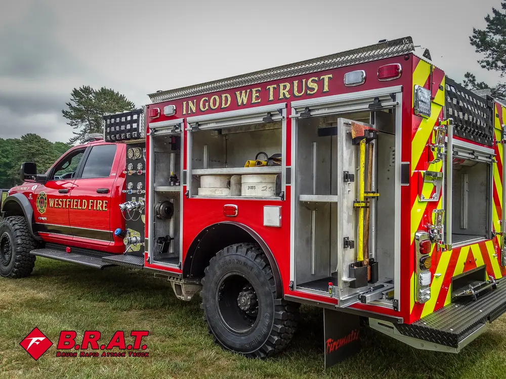 Rear-left side angle with several open compartments and mounted tools.