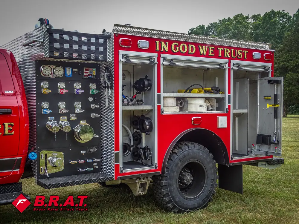 Pump-side control panel and open compartments on the truck's left side.