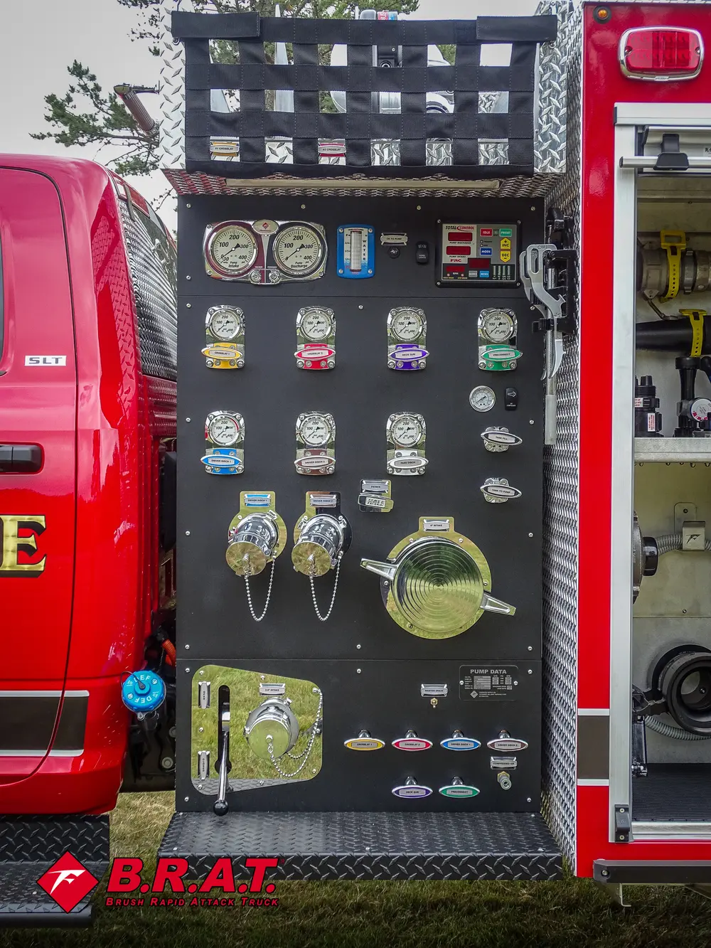 Pump control panel close-up with pressure gauges and valve levers.