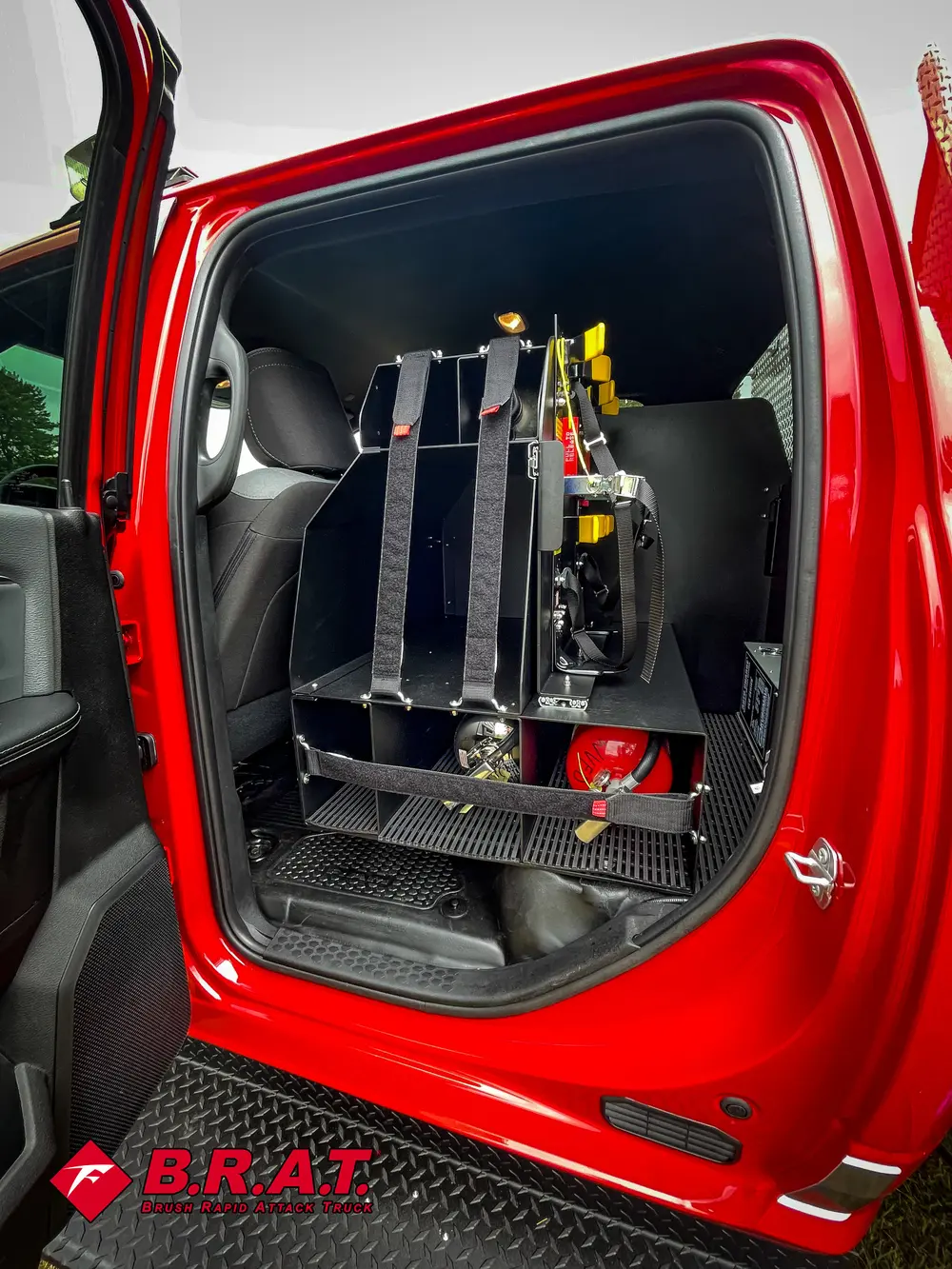 Rear-seat area close-up with mounted equipment and floor platform.