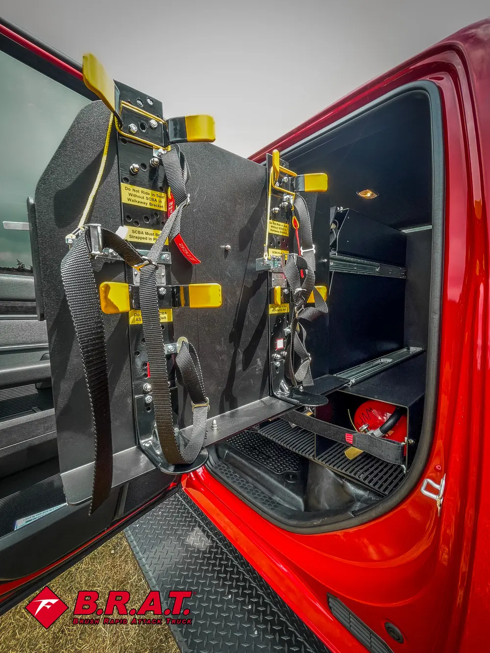 Rear-seat tool rack close-up with straps, compartments, and mounted gear.