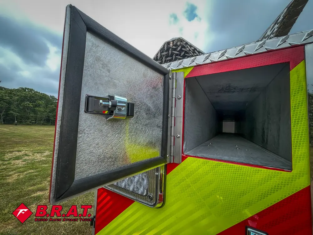 Open rear corner tube compartment with long enclosed storage channel.