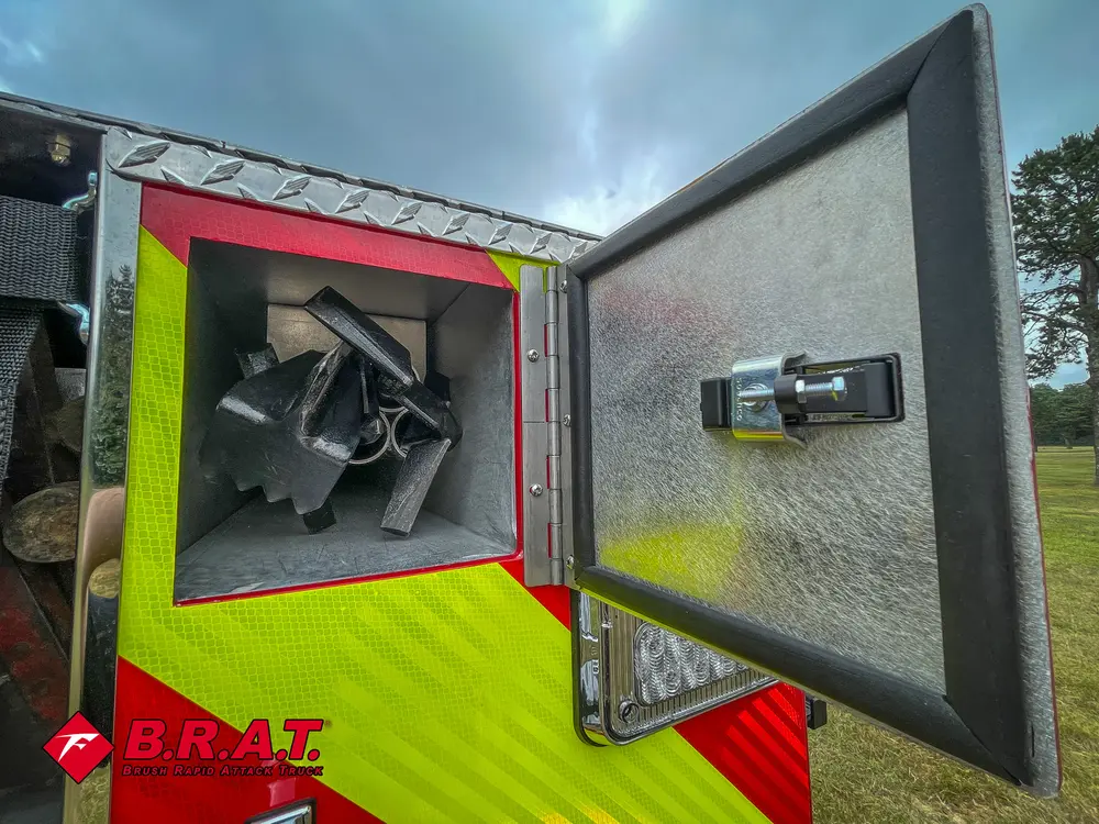 Open rear corner compartment with mounted triangular bracket assembly.