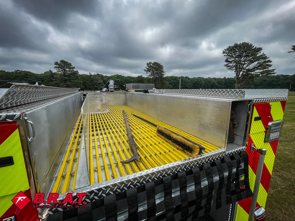 Top deck view showing yellow grated walkway and side rails.