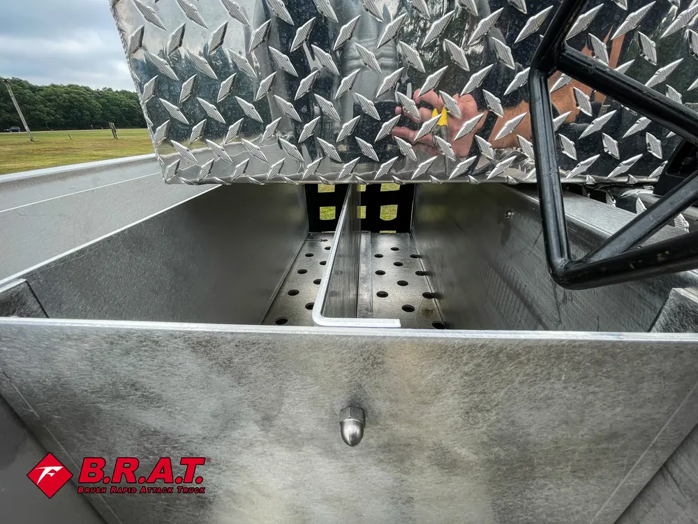 Upper deck corner close-up with diamond-plate panel and hardware.