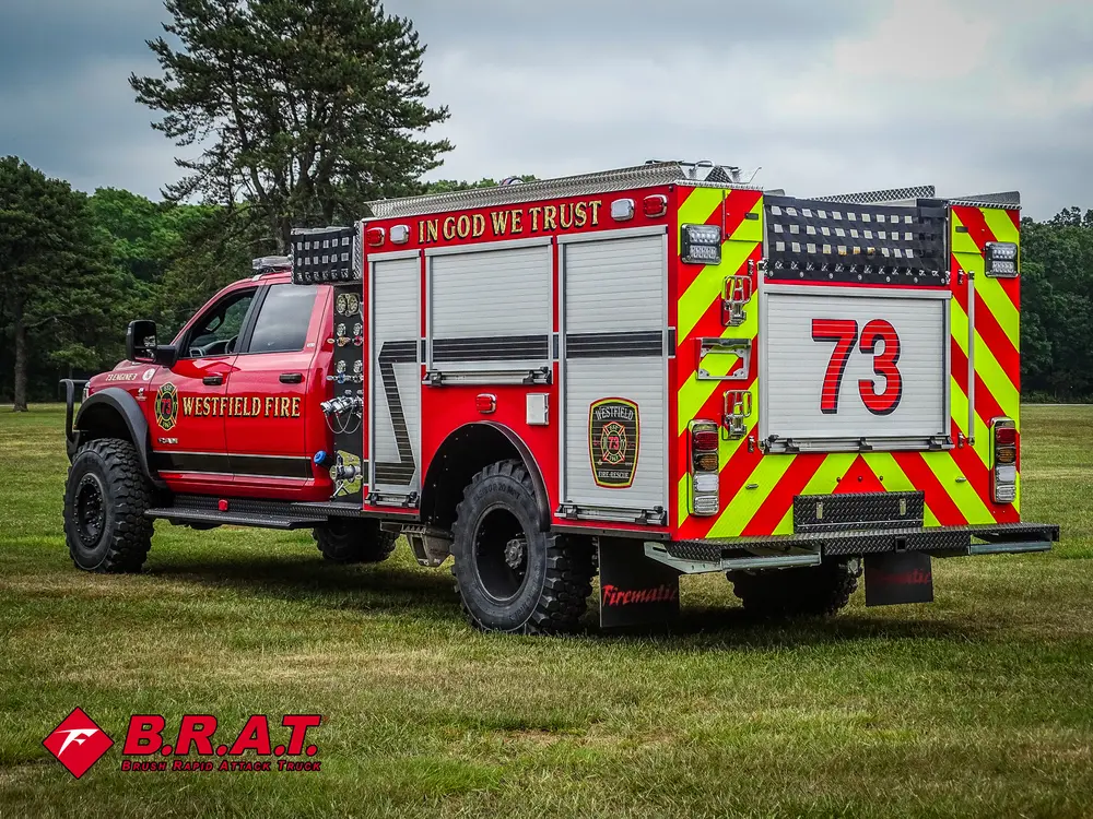 Rear-right angle of the truck showing side compartments and rear chevrons.