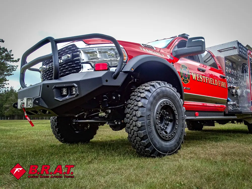 Low front-left exterior angle highlighting bumper, brush guard, and tire.