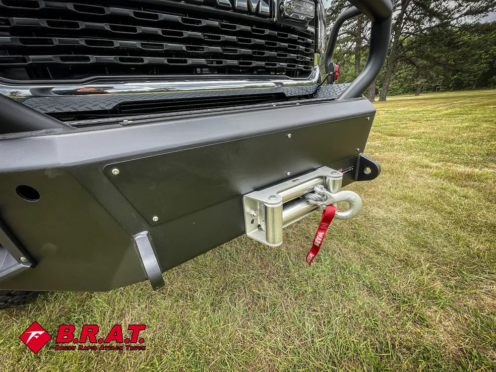 Winch fairlead and bumper center close-up under grille.