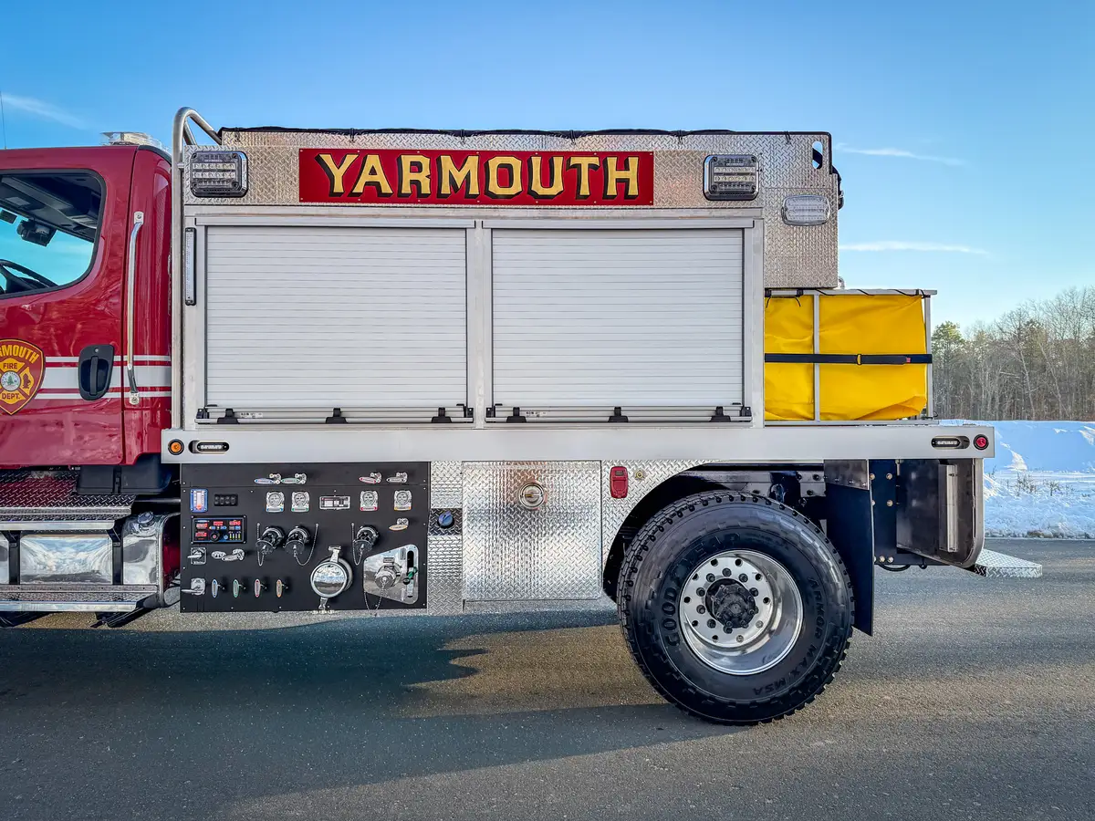 Right-side mid-body close-up with closed roll-up compartments and pump controls below.