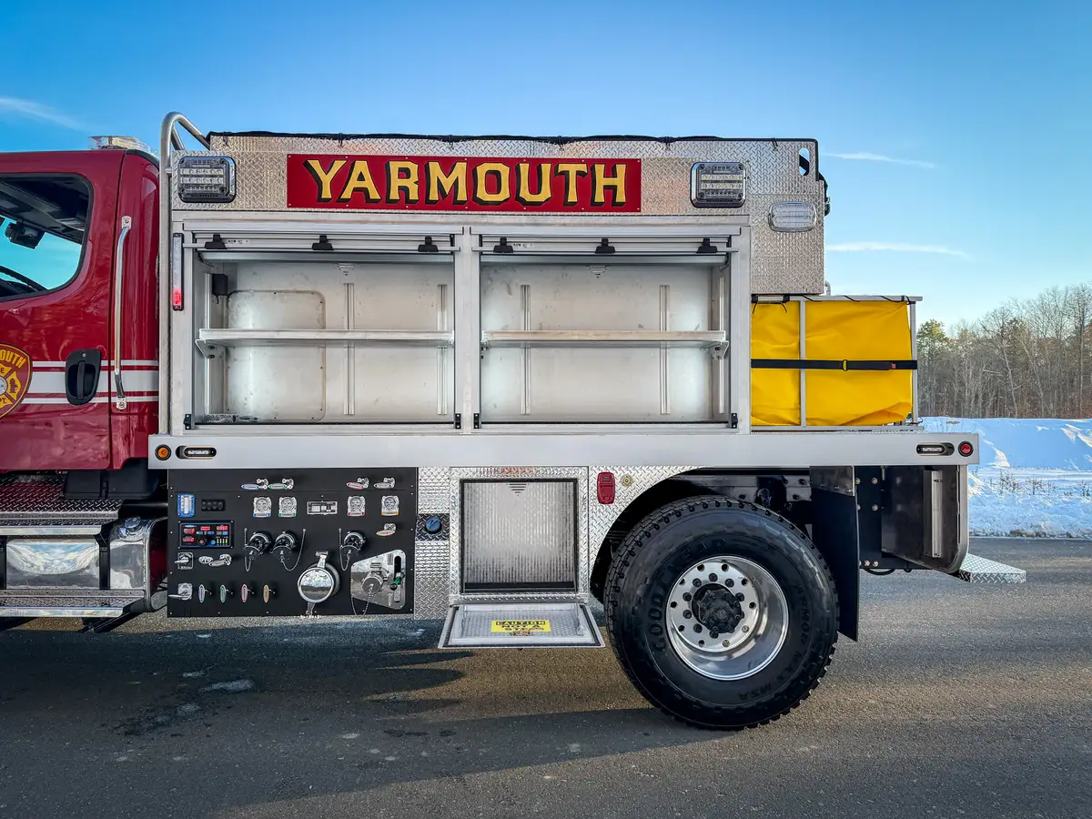 Right-side mid-body view with upper compartments and lower tank compartment doors open.