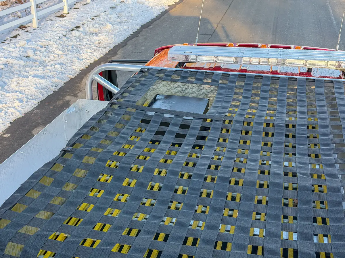 Top-front hosebed view showing the net cutout near the lightbar.