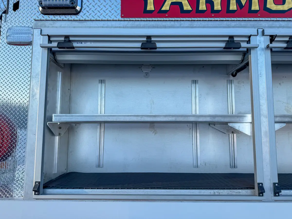 Close-up of an open right-side upper compartment shelf.