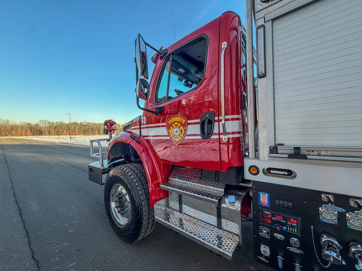 Right cab door open, showing entry steps and access to the cab interior.