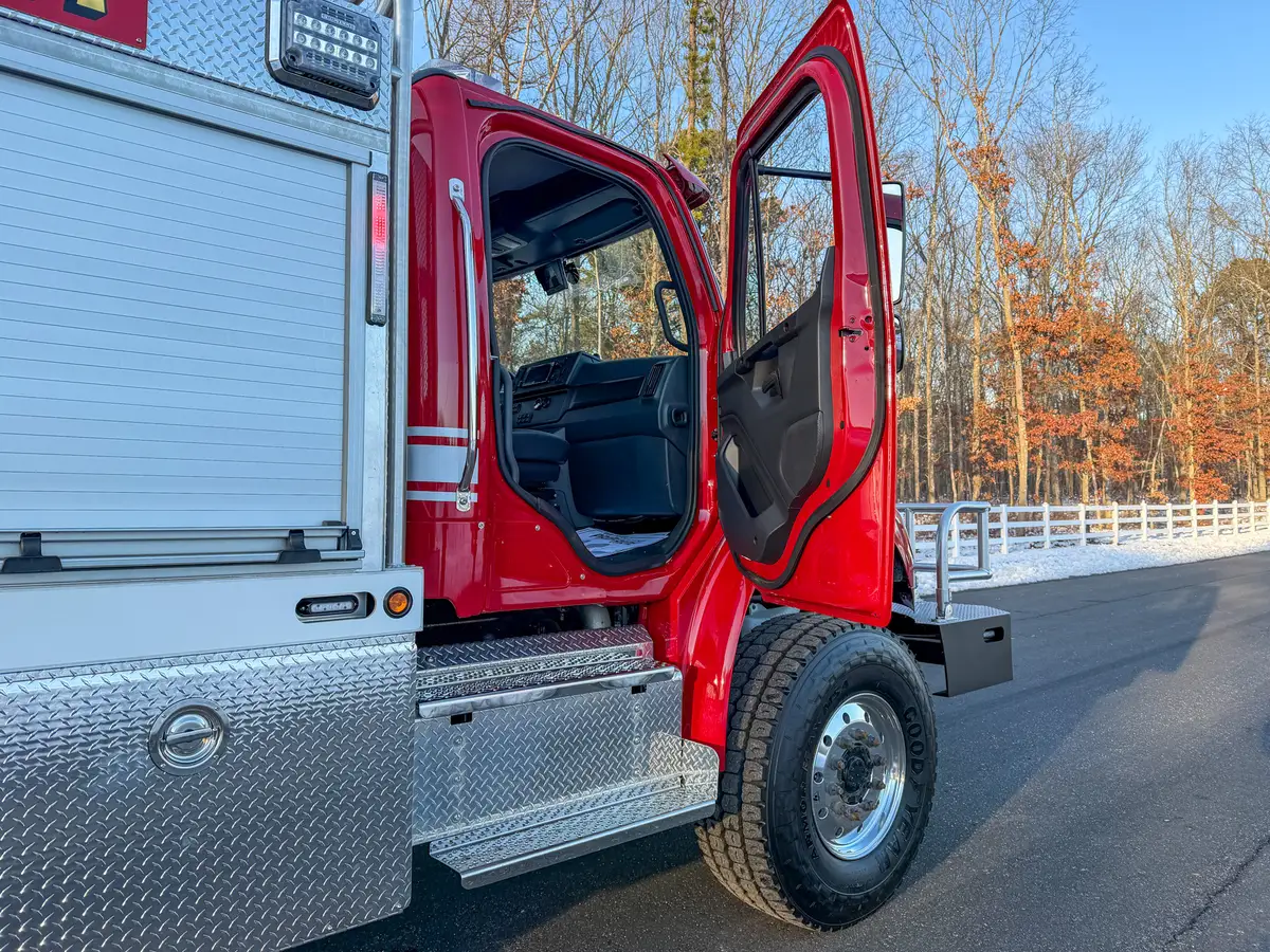 Interior view from rear passenger side showing seats and center control console.