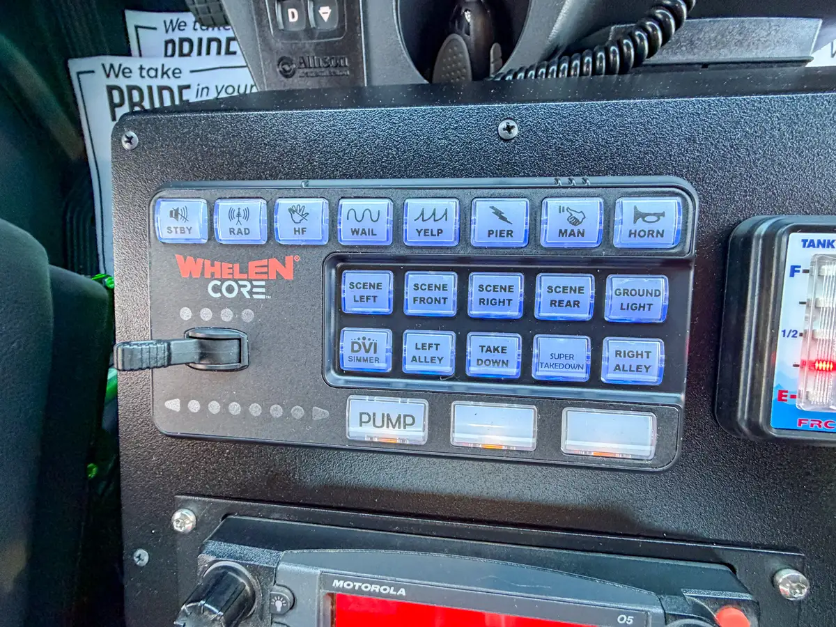 Dashboard center-stack close-up with radio, gauges, and climate controls.