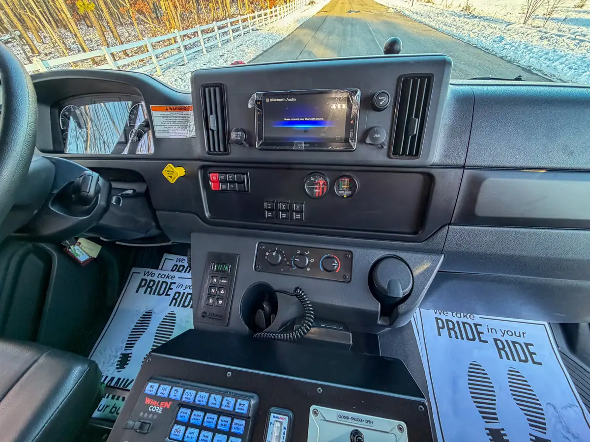 Interior upward view showing rear camera monitor above the windshield.