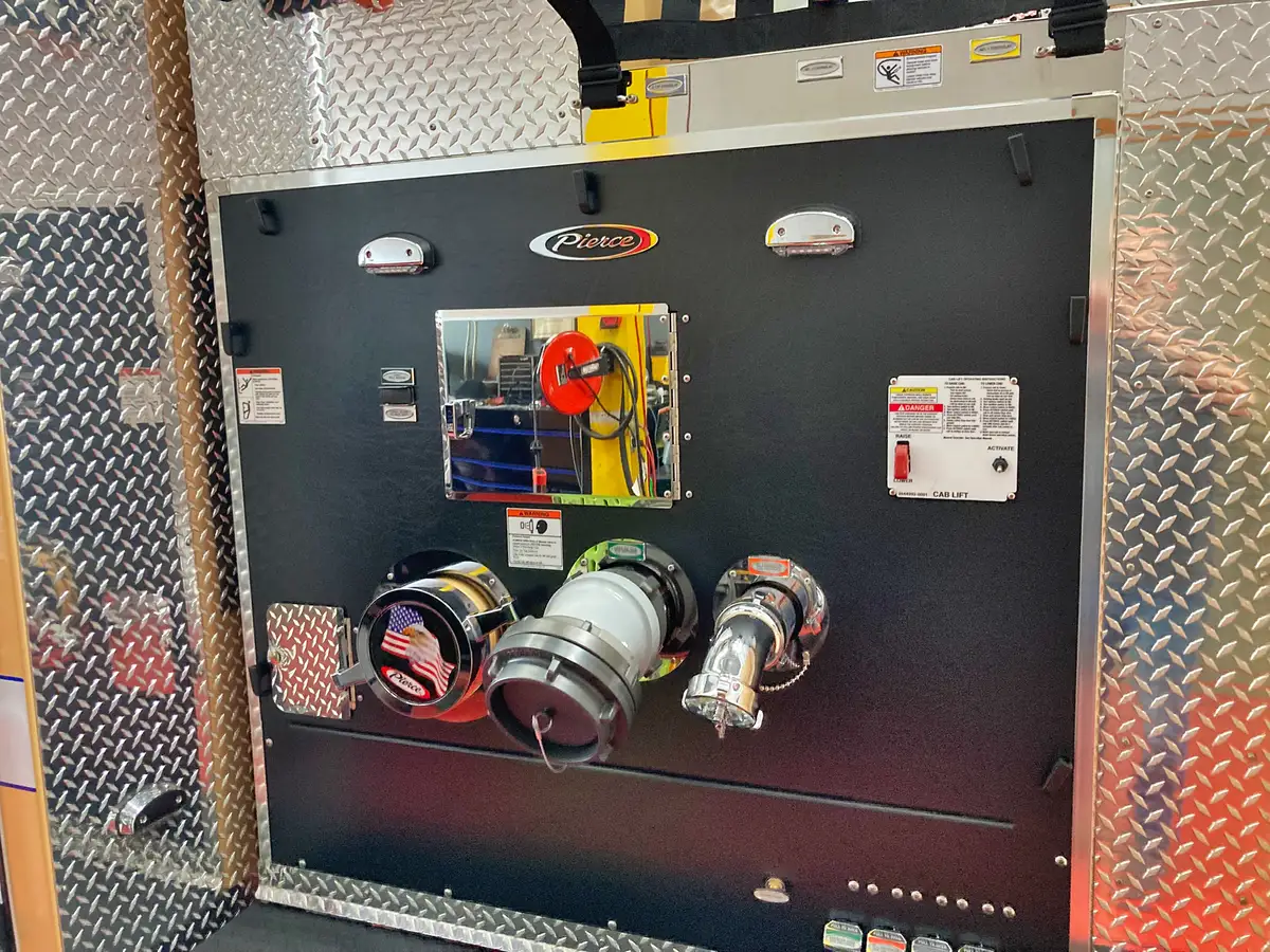 Rear intake panel close-up showing intake ports, connections, and control label panel