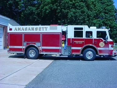 Driver-side profile view showing long body compartments and wheel area