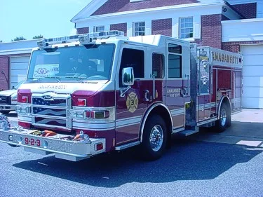 Front-left view showing open pump panel area and side compartments