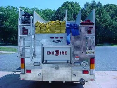 Rear view showing hose bundles in hosebed and rear warning lights