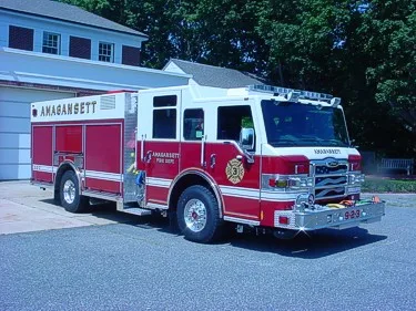 Front-left exterior view showing bumper, cab, and side compartments