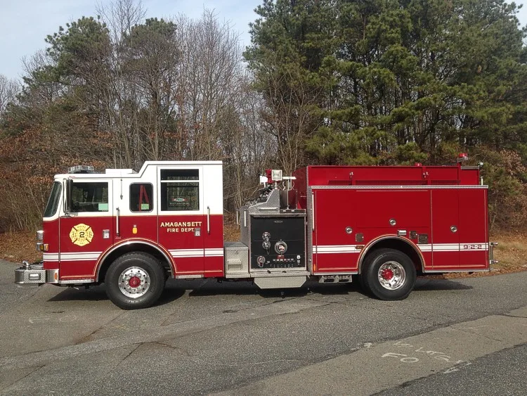 Driver-side profile showing pump panel controls, side compartments, and wheel/tire layout.