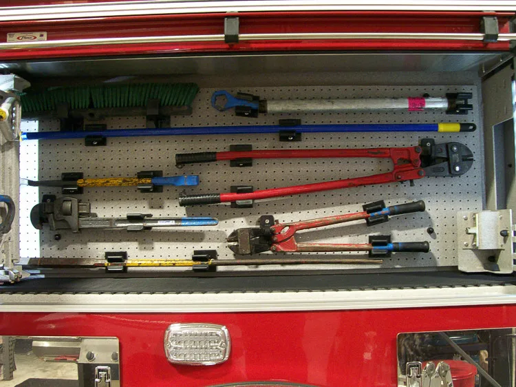 Open side compartment showing long tools and additional shelf storage