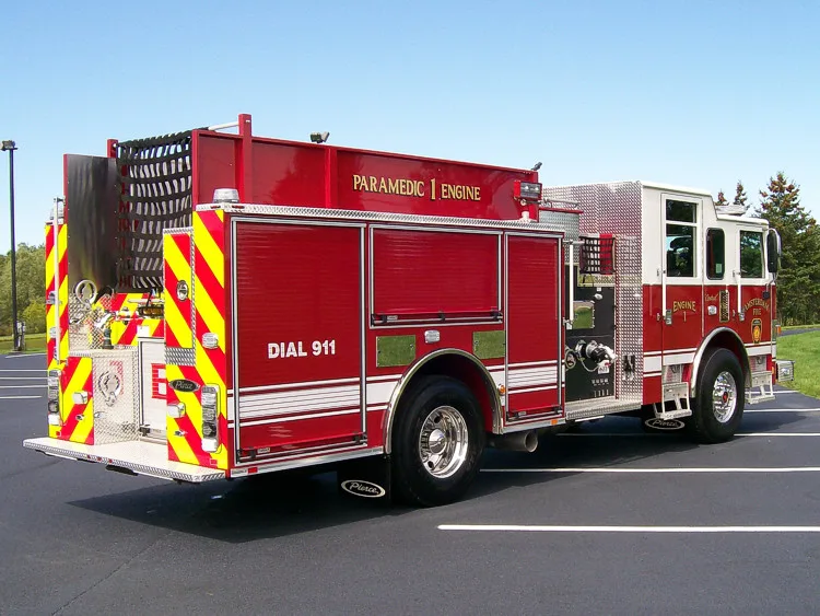 Rear-left exterior view showing side body and rear chevron panel