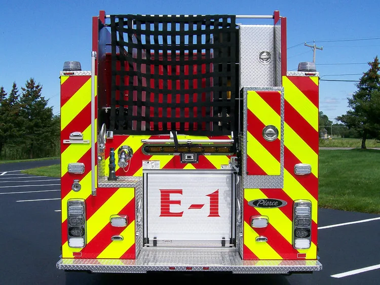 Rear view showing red-and-yellow chevrons and upper hosebed netting