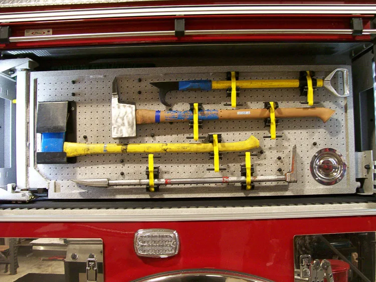 Open side compartment showing long tools and rack-mounted hand tools