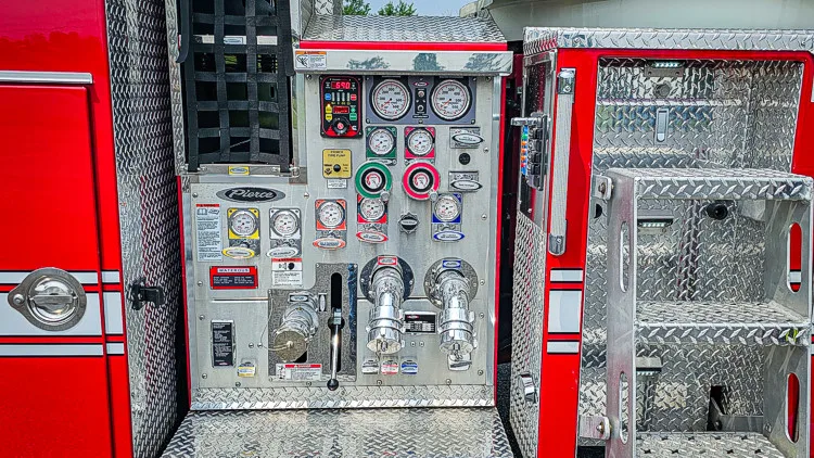 Pump panel close-up showing gauges, valves, and intake controls