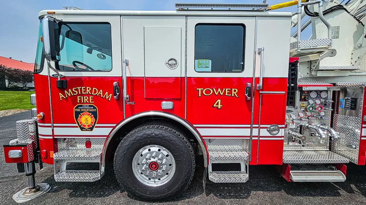 Cab-side close-up showing unit number and department crest on door