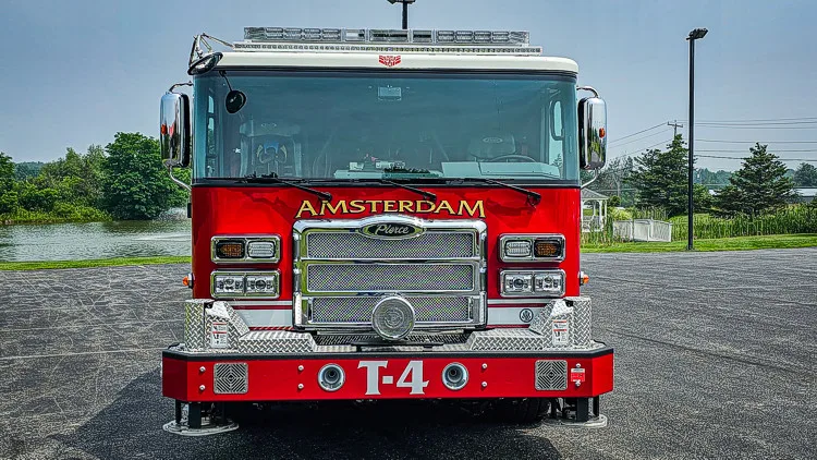 Head-on front view showing grille, bumper, and warning lights