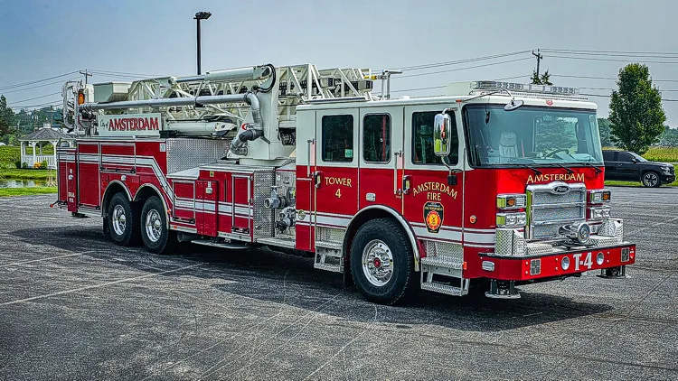 Front-left exterior profile showing aerial ladder truck and side body