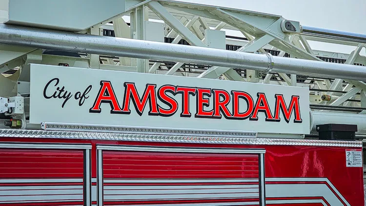 Ladder beam close-up showing city lettering on white aerial section