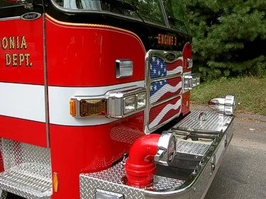 Front bumper close-up showing intake fittings and treadplate step