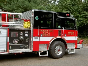 Driver-side pump panel area close-up showing gauges and control valves
