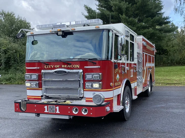 Pumper front-left exterior view showing grille, bumper, and side body