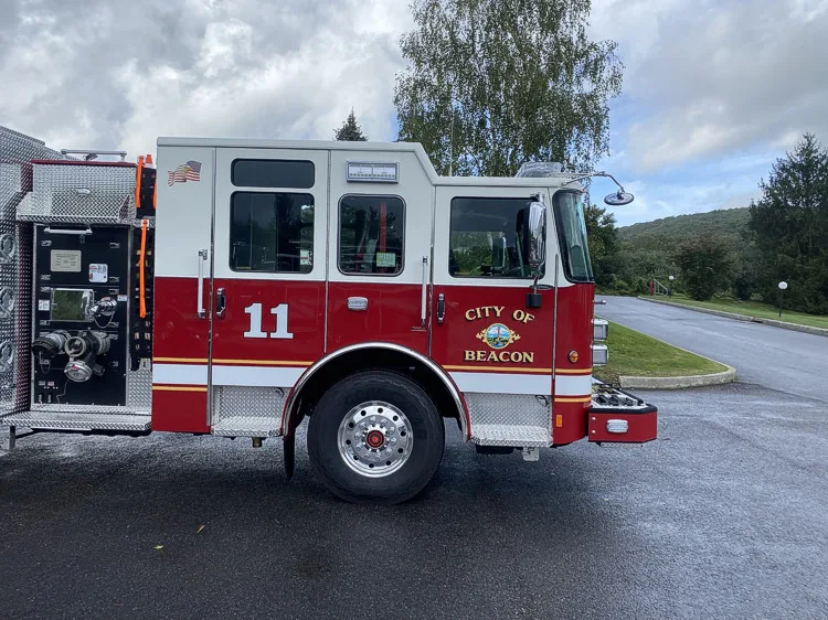 Driver-side profile with open pump-side panel showing controls and fittings