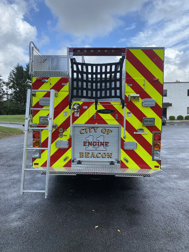 Rear view showing red-and-yellow chevrons and centered rear panel