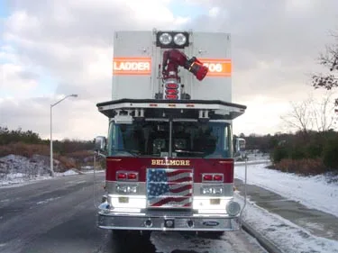 Head-on front view showing grille and elevated bucket platform