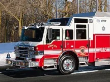 Bellmore heavy rescue truck front-left exterior view showing enclosed cab and rescue body compartments