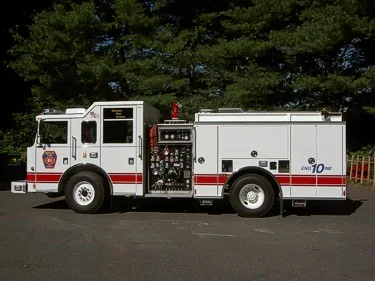 Driver-side profile with open pump panel showing gauges and controls