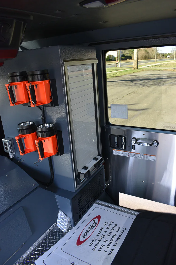 Cab interior side view showing mounted controls and side console