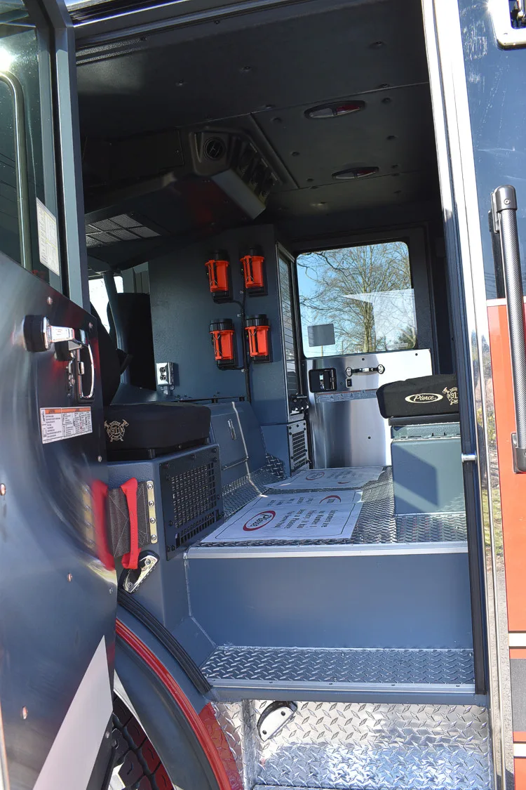 Rear crew cab interior view showing seat row and center aisle