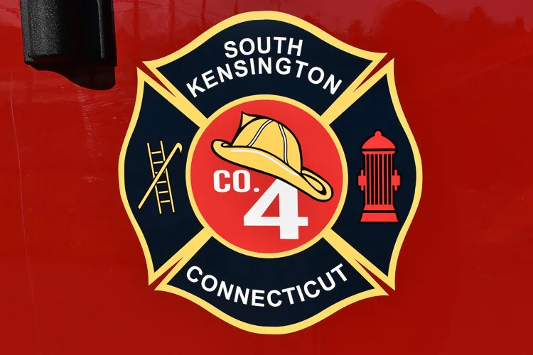 Cab door close-up showing shield-style company crest