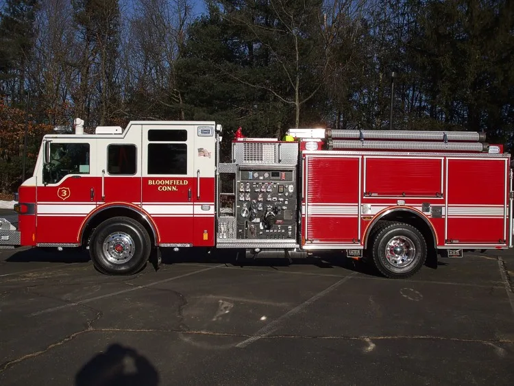 Full left-side profile showing midship pump panel, side compartments, and wheel/tire layout.